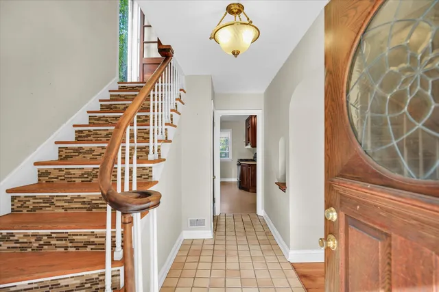 a view of entryway with wooden floor