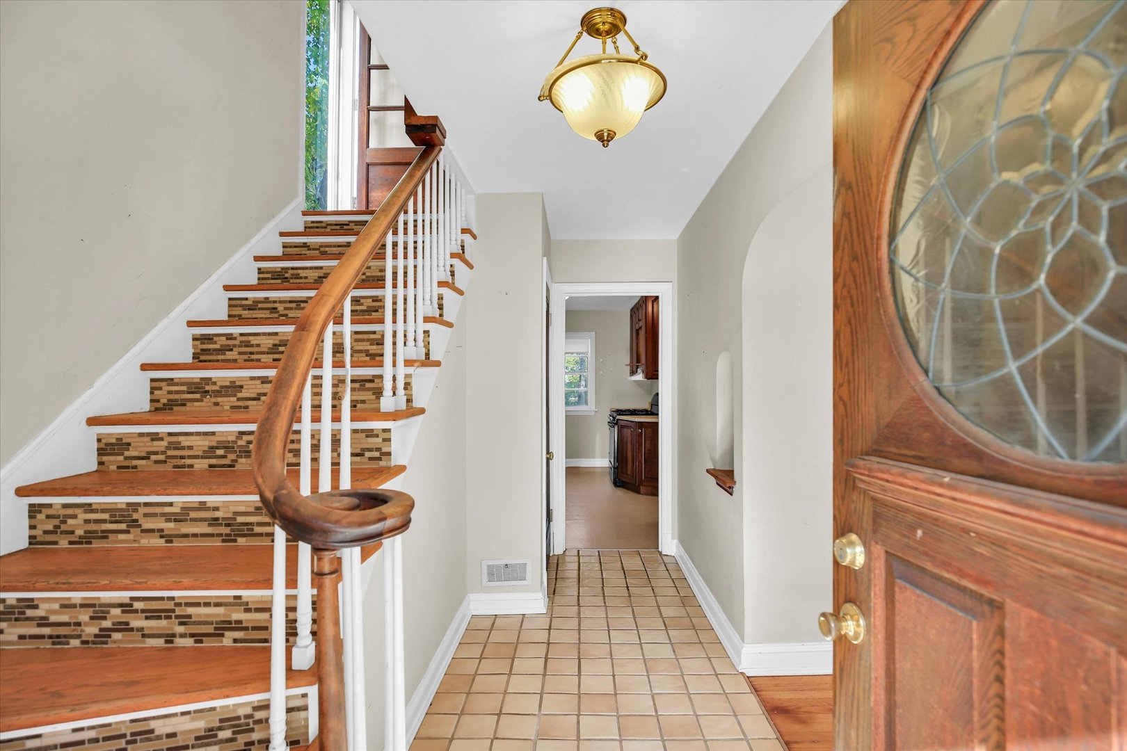 910 West Springfield Avenue Champaign, IL 61821 - Photo 6 of 45 a view of entryway with wooden floor