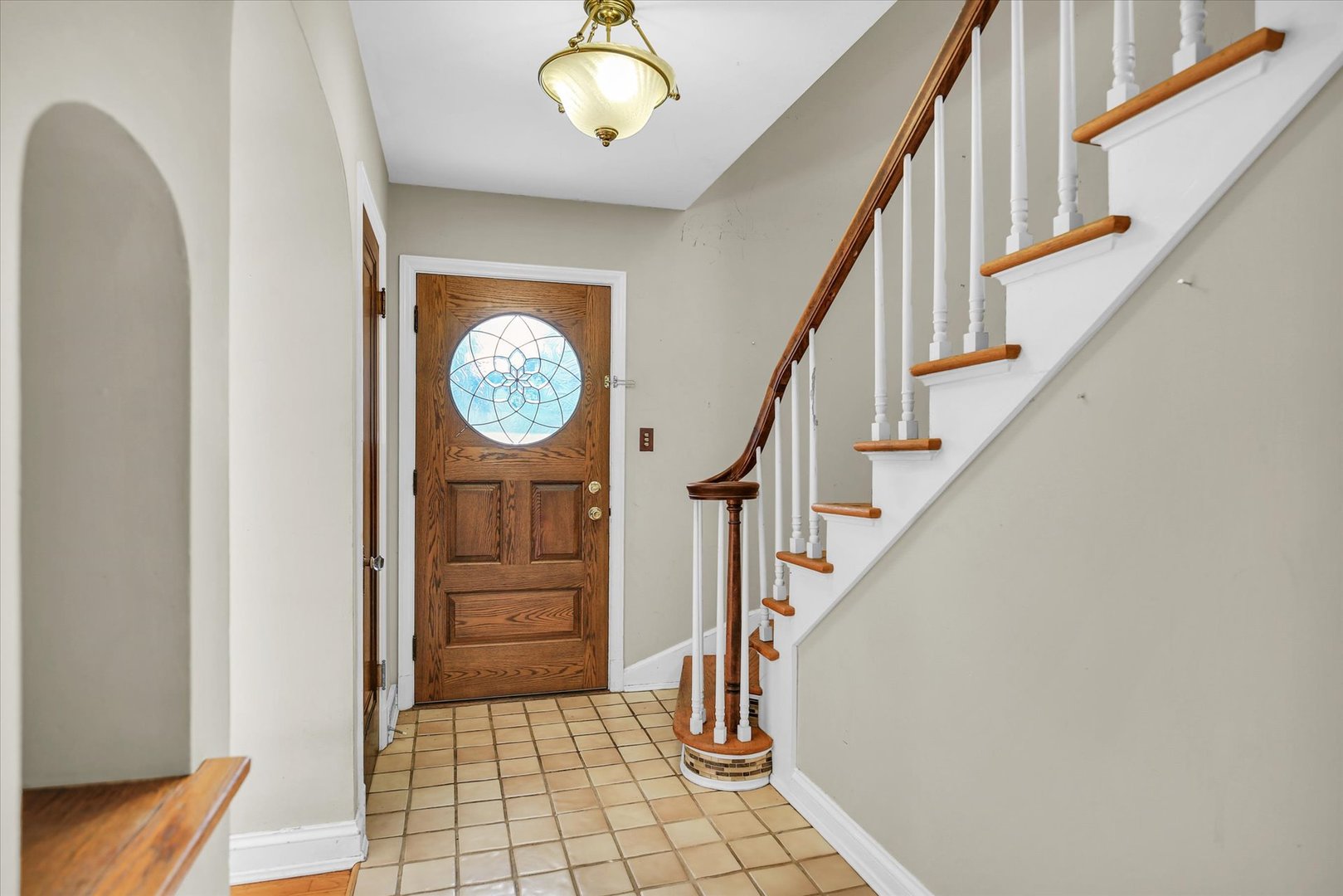 910 West Springfield Avenue Champaign, IL 61821 - Photo 7 of 45 a view of a hallway with entryway wooden floor and front door
