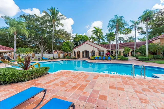 a view of swimming pool with lounge area