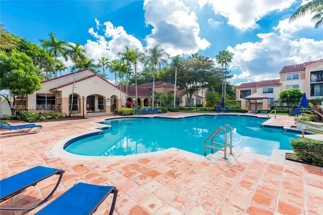 a house with swimming pool in front of it