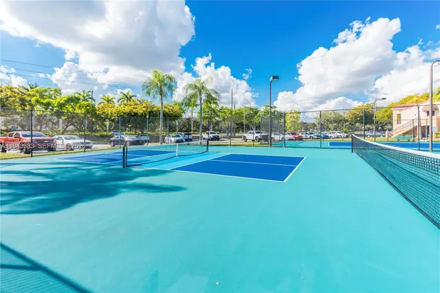 a view of a playground with basketball court
