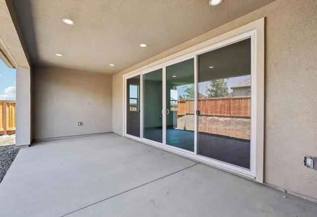 a bedroom with a bed and flat screen tv