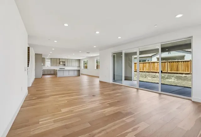 a view of kitchen and kitchen with furniture wooden floor