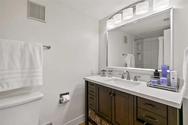 a bathroom with a double vanity sink and mirror