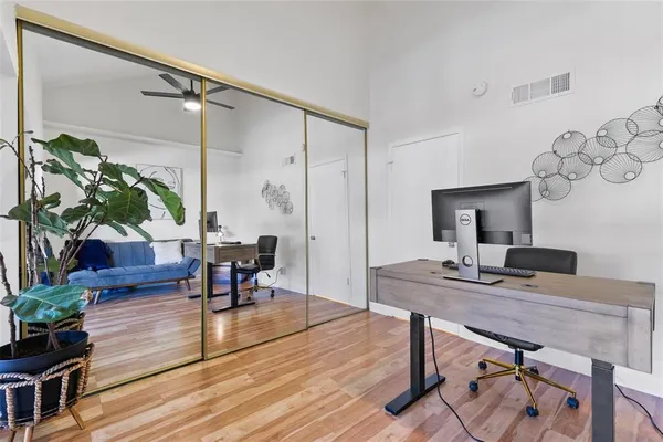 a workspace with furniture and wooden floor