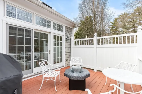a view of a deck with furniture