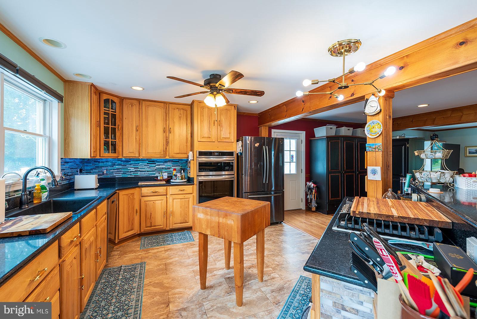 2613 Hoopers Island Road Fishing Creek, MD 21634 - Photo 12 of 54 a living room with stainless steel appliances furniture and a kitchen