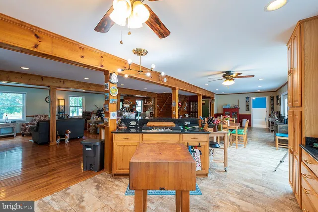 a view of a dining room with furniture and a window