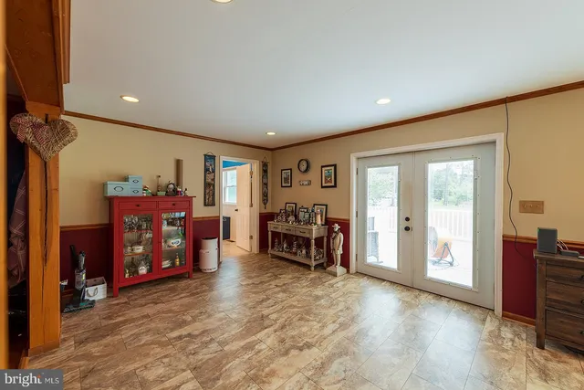 a bathroom with a granite countertop toilet sink and mirror