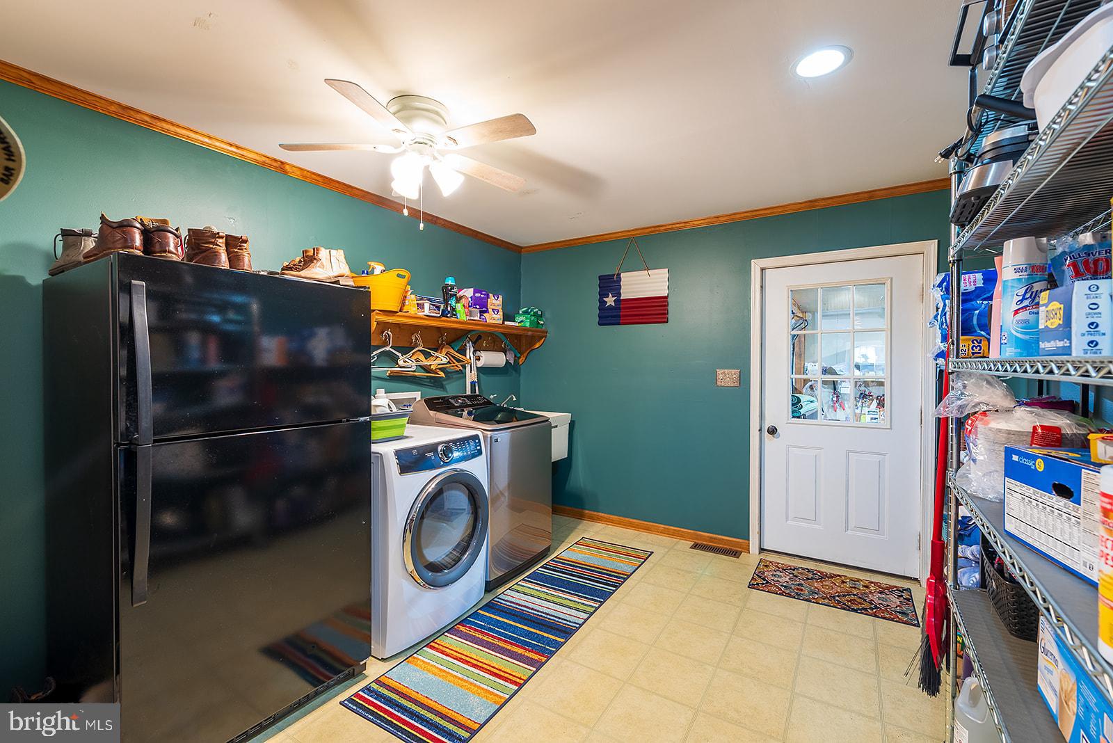 2613 Hoopers Island Road Fishing Creek, MD 21634 - Photo 20 of 54 a storage room with washer and dryer