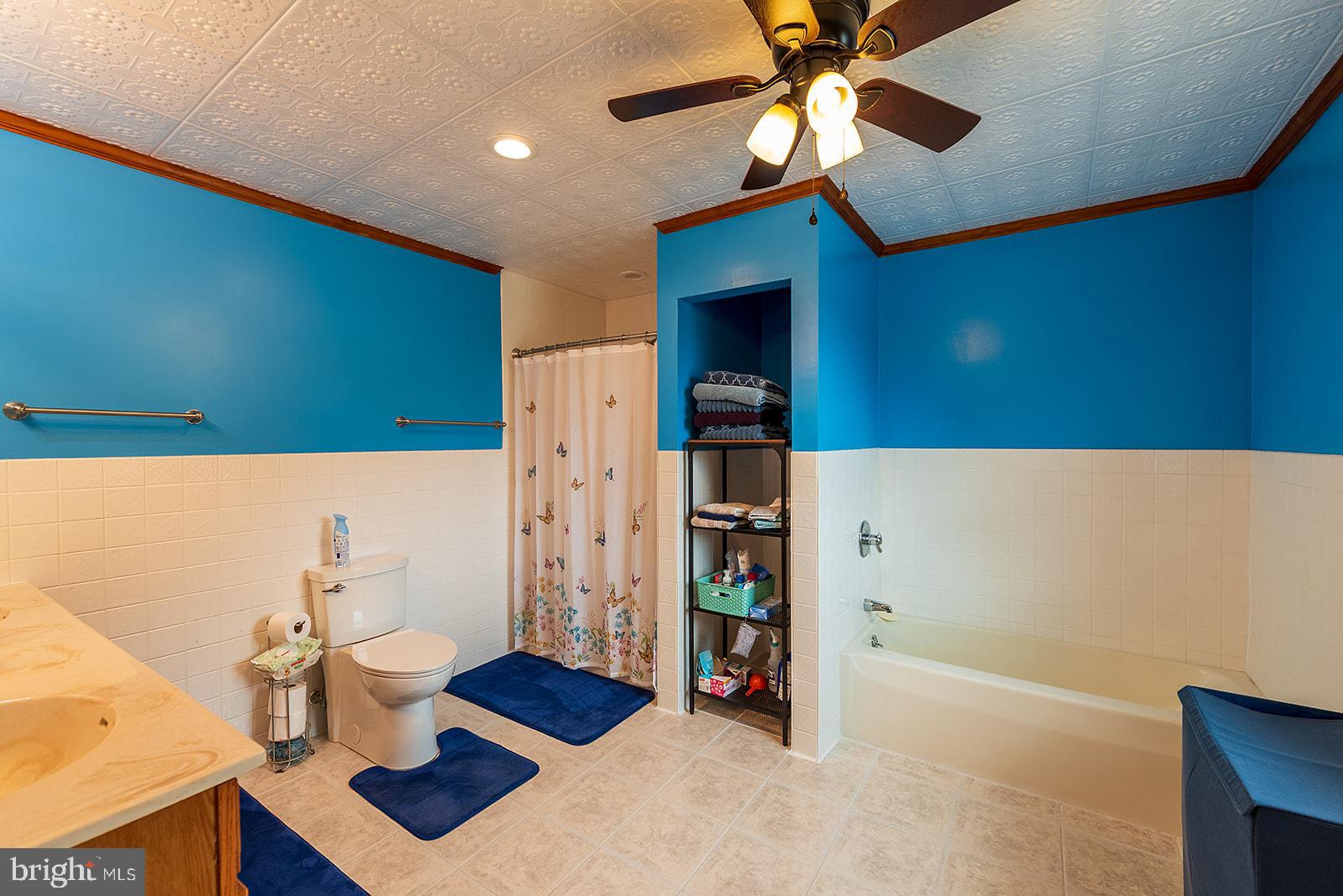 2613 Hoopers Island Road Fishing Creek, MD 21634 - Photo 23 of 54 a bathroom with a sink and a mirror