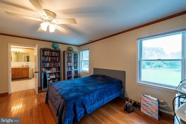 a bedroom with bed and a chandelier