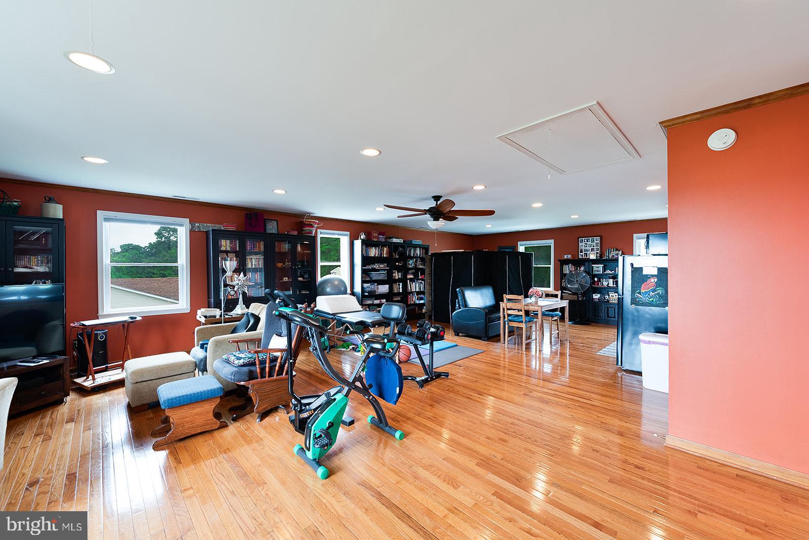 2613 Hoopers Island Road Fishing Creek, MD 21634 - Photo 32 of 54 a view of a living room with dining room and wooden floor