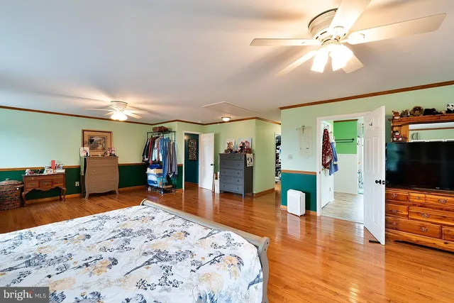 a view of a backyard with table and chairs and brick wall