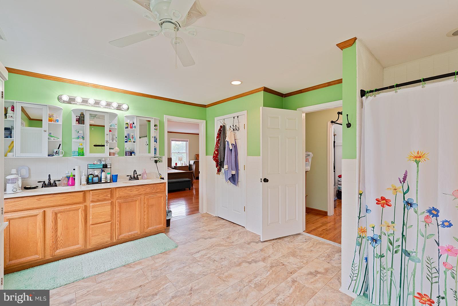 2613 Hoopers Island Road Fishing Creek, MD 21634 - Photo 42 of 54 a kitchen that has a lot of cabinets and wooden floor