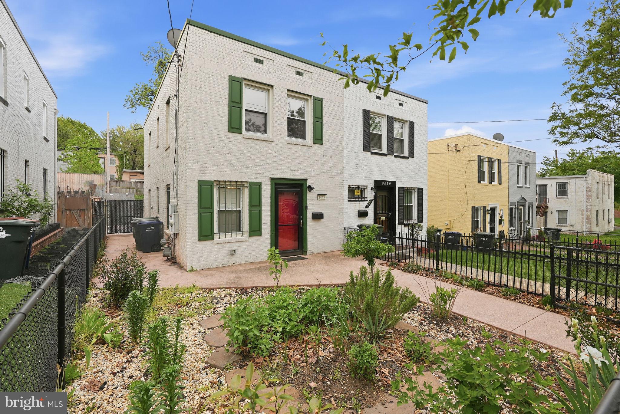 3417 B Street Southeast Washington, DC 20019 - Photo 2 of 22 a front view of a house with a porch
