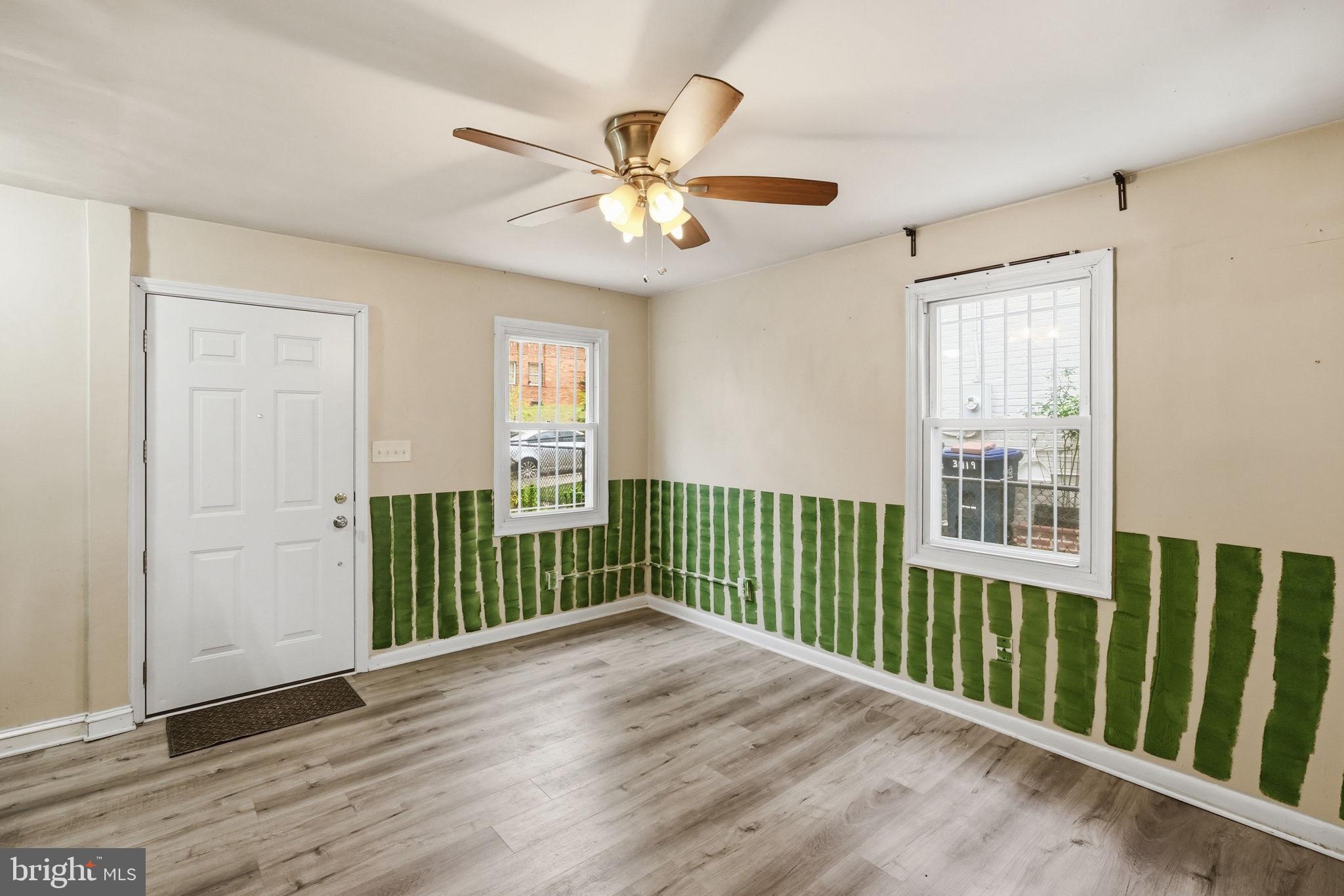 3417 B Street Southeast Washington, DC 20019 - Photo 6 of 22 a view of a room with wooden floor fan and windows