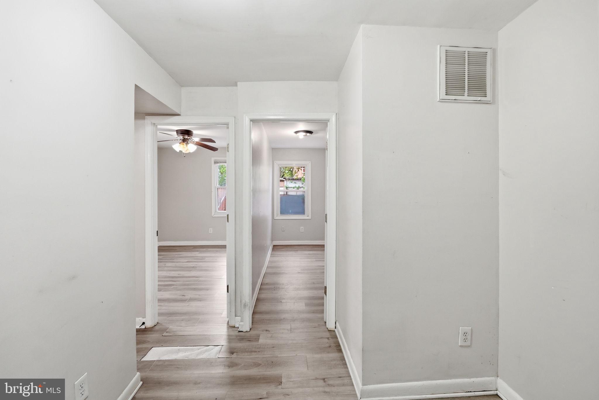 3417 B Street Southeast Washington, DC 20019 - Photo 7 of 22 a view of a hallway with wooden floor and staircase