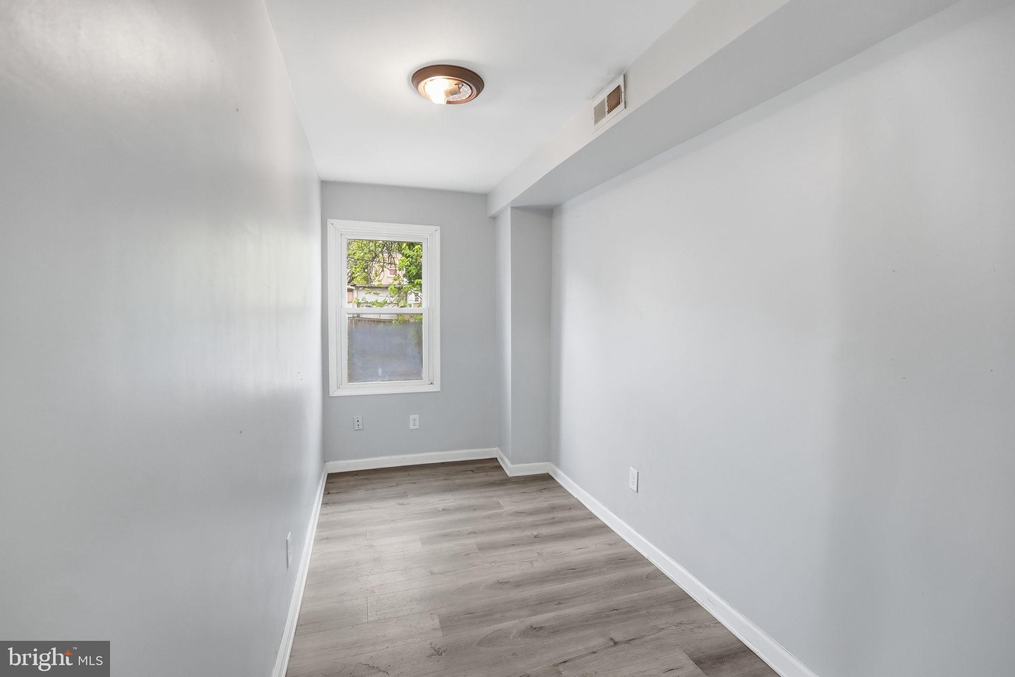 3417 B Street Southeast Washington, DC 20019 - Photo 10 of 22 a view of room with window and hardwood floor