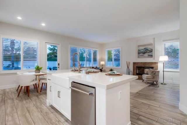 a kitchen with a stove a sink and a refrigerator