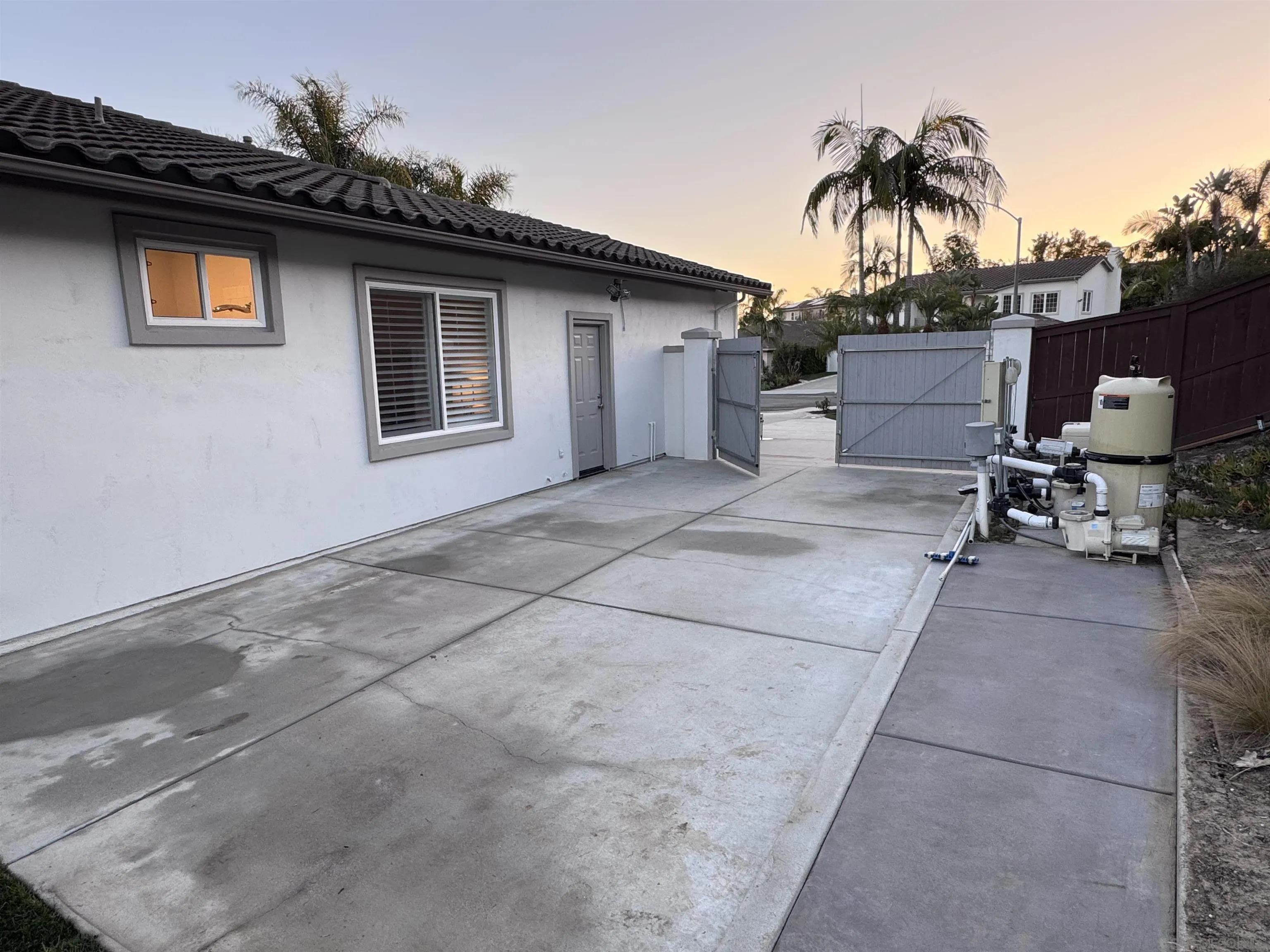 6814 Moorhen Place Carlsbad, CA 92011 - Photo 36 of 37 a backyard of a house with table and chairs