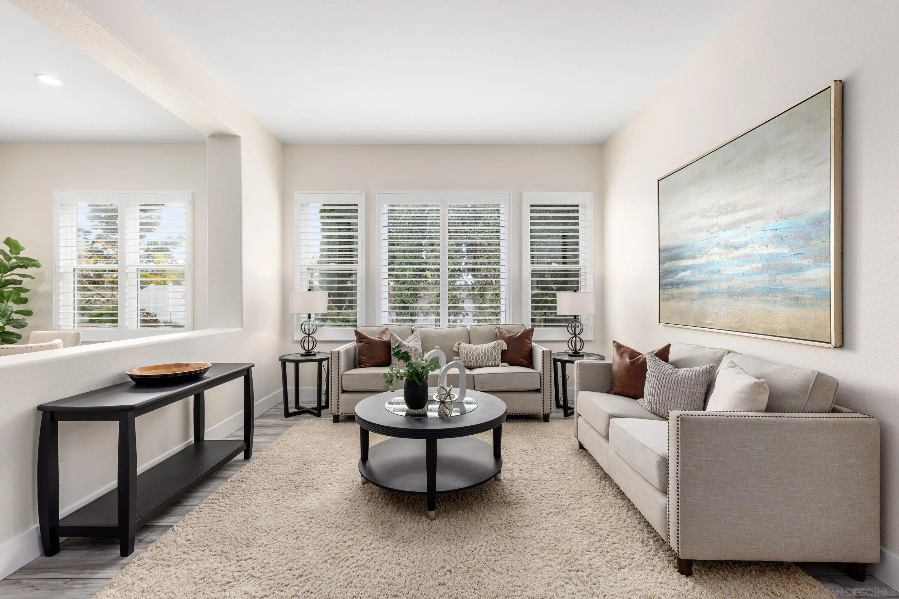 6814 Moorhen Place Carlsbad, CA 92011 - Photo 6 of 37 a living room with furniture and a large window