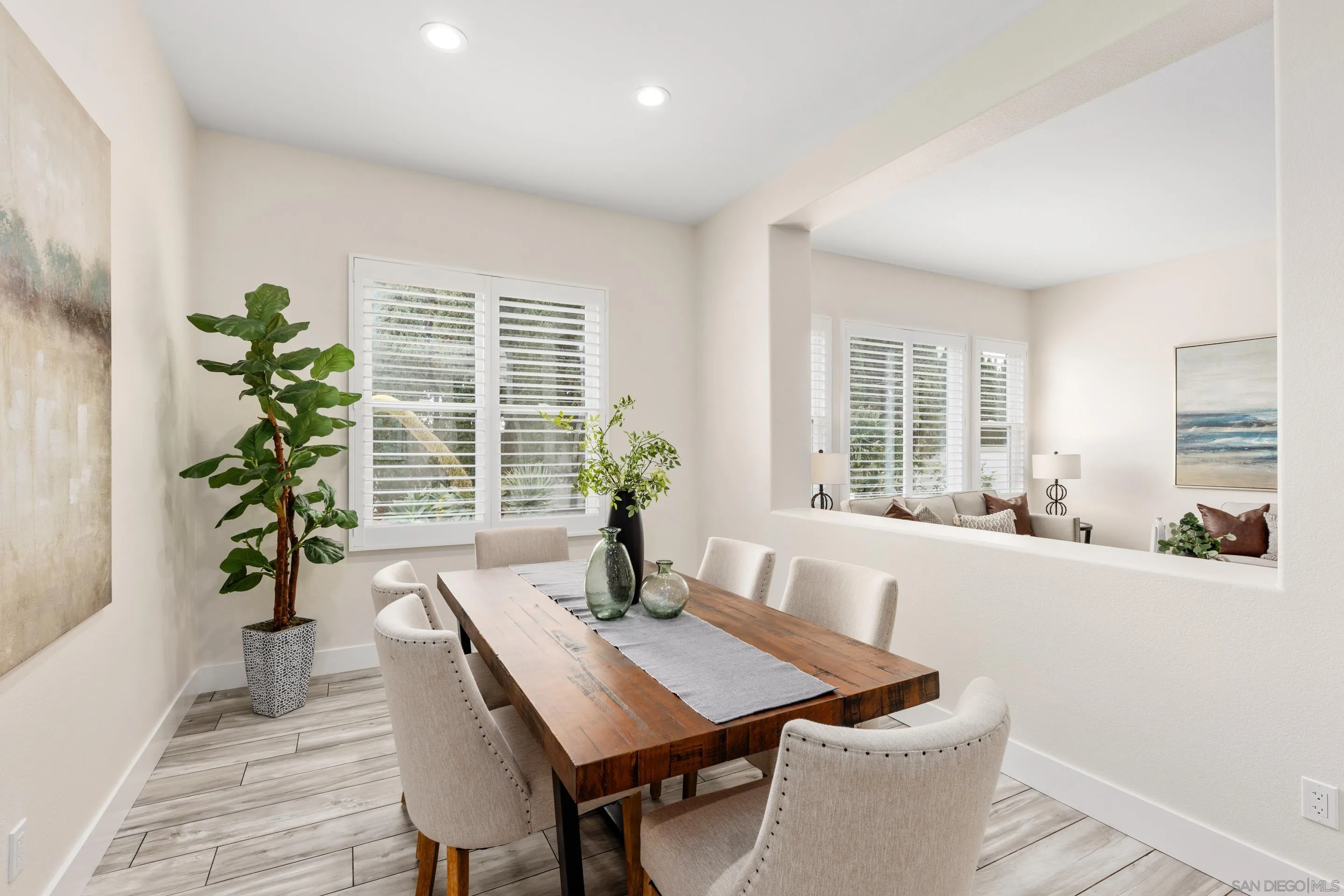 6814 Moorhen Place Carlsbad, CA 92011 - Photo 7 of 37 a view of a dining room with furniture window and wooden floor