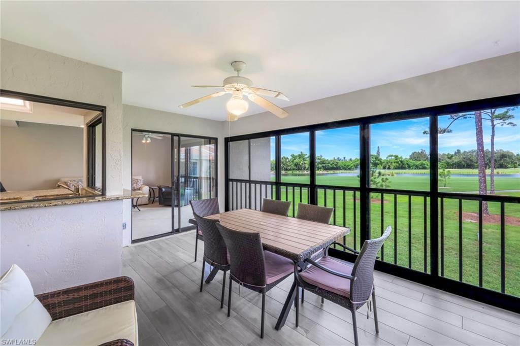 5585 Trailwinds Drive, Unit 326 Fort Myers, FL 33907 - Photo 1 of 37 a view of a dining room with furniture window and wooden floor