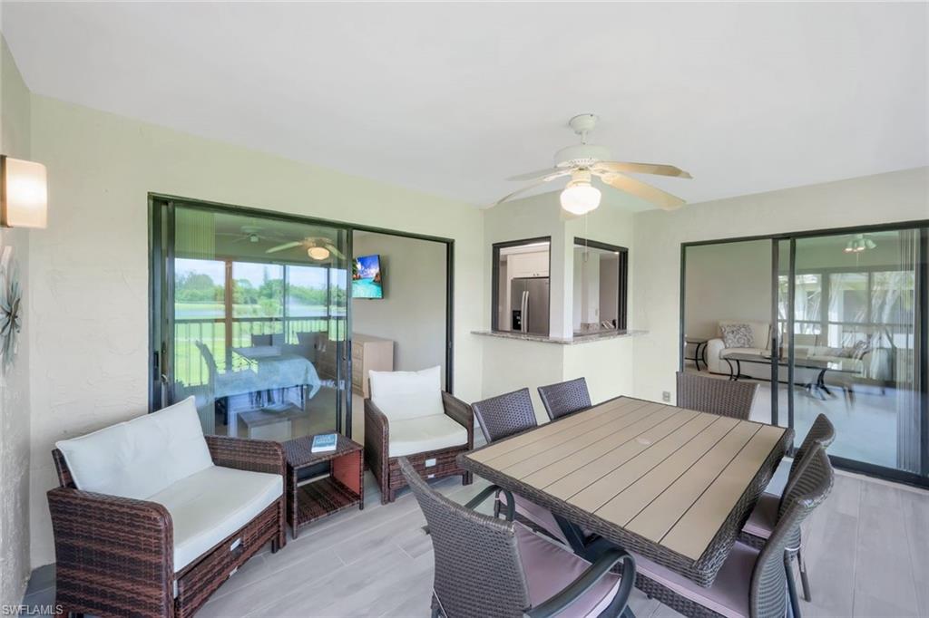 5585 Trailwinds Drive, Unit 326 Fort Myers, FL 33907 - Photo 22 of 37 a view of a dining room with furniture window and outside view