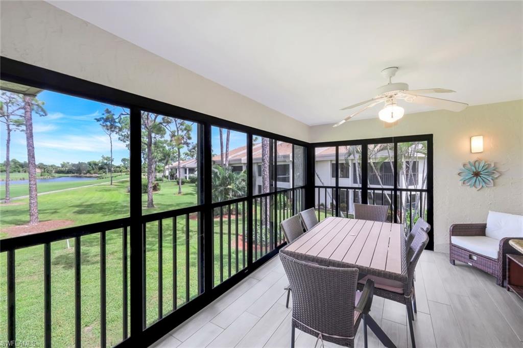 5585 Trailwinds Drive, Unit 326 Fort Myers, FL 33907 - Photo 23 of 37 a view of a room with furniture window and wooden floor