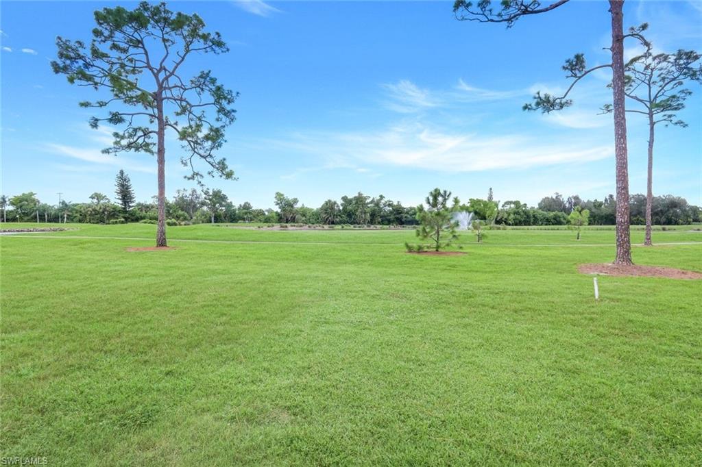 5585 Trailwinds Drive, Unit 326 Fort Myers, FL 33907 - Photo 28 of 37 a view of a park with large trees