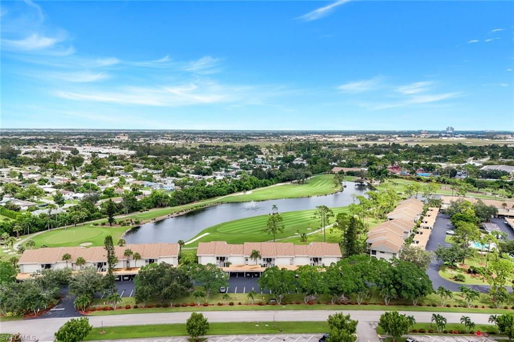 5585 Trailwinds Drive, Unit 326 Fort Myers, FL 33907 - Photo 29 of 37 an aerial view of a city with lots of residential buildings and ocean view in back