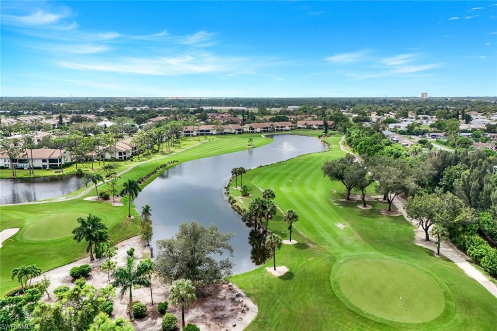 5585 Trailwinds Drive, Unit 326 Fort Myers, FL 33907 - Photo 33 of 37 an aerial view of a golf course with swimming pool