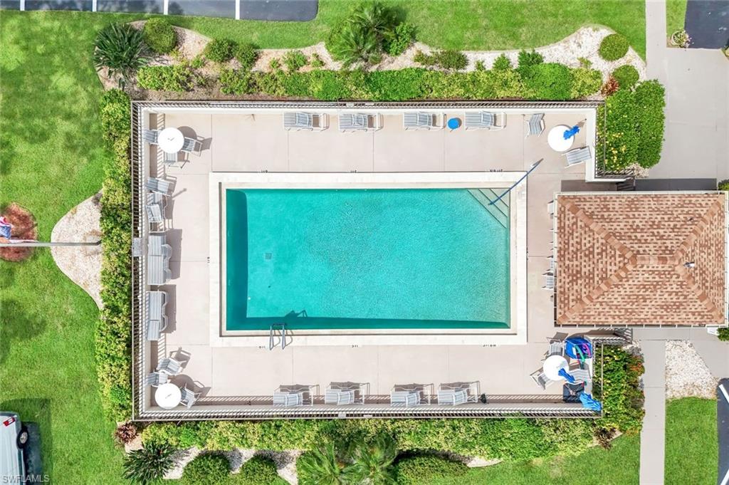 5585 Trailwinds Drive, Unit 326 Fort Myers, FL 33907 - Photo 37 of 37 a view of outdoor space with seating area