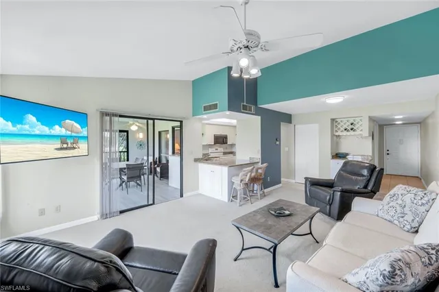a living room with furniture and a table