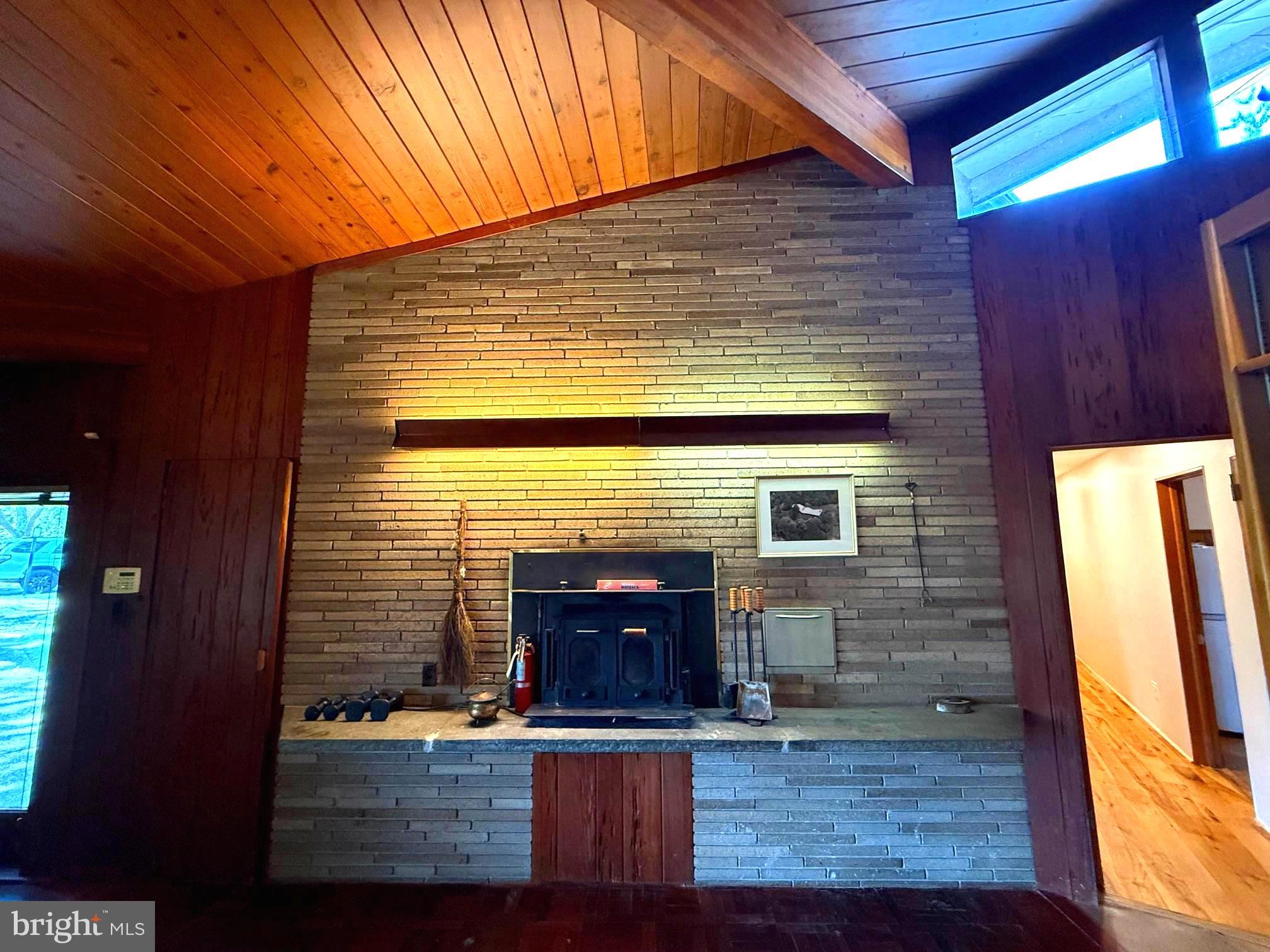 108 South Spring Valley Road Wilmington, DE 19807 - Photo 24 of 84 Brick wall w/ suspended Hearth Wood Stove