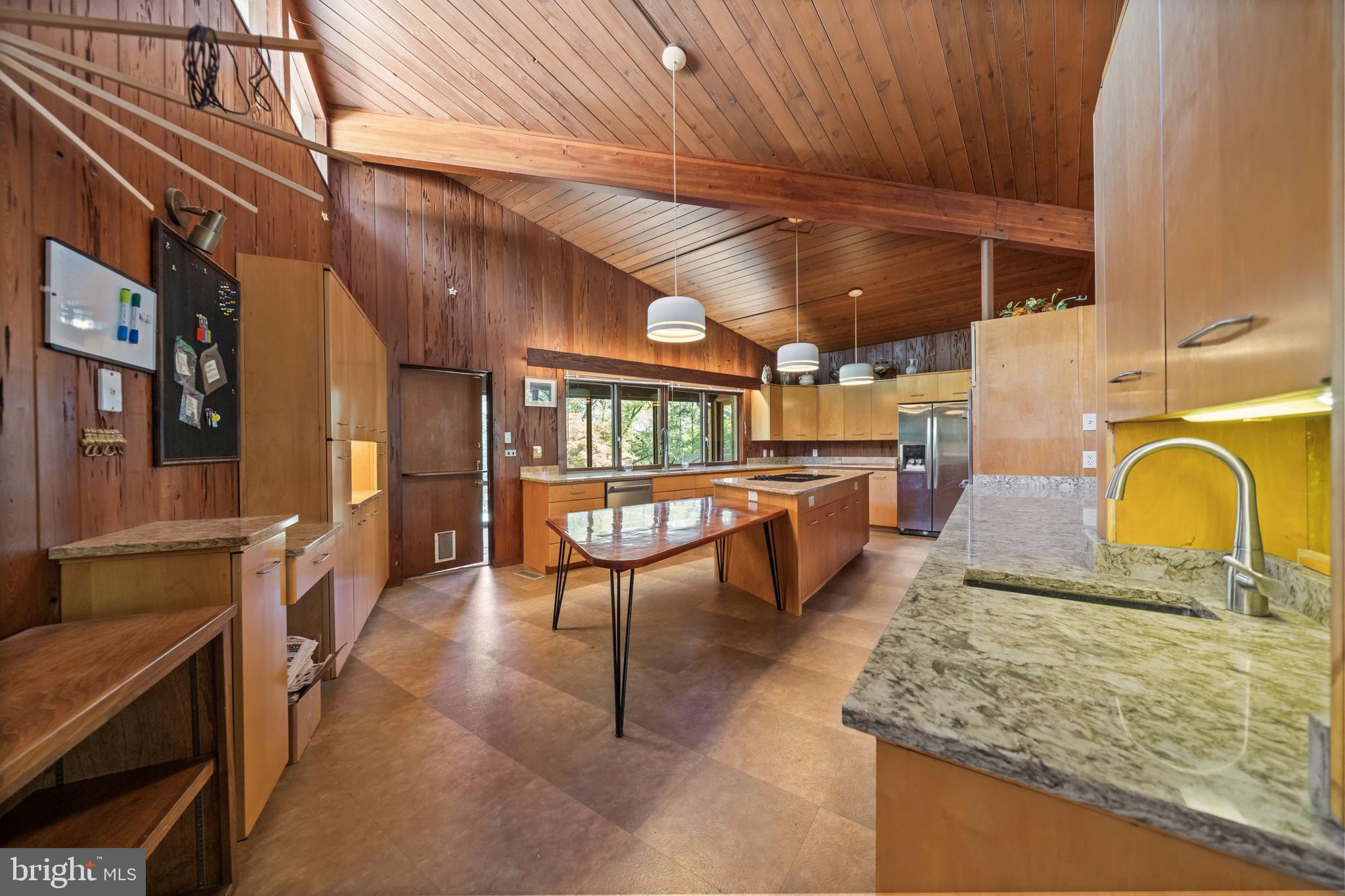 108 South Spring Valley Road Wilmington, DE 19807 - Photo 33 of 84 a view of a kitchen with stainless steel appliances granite countertop lots of wooden furniture