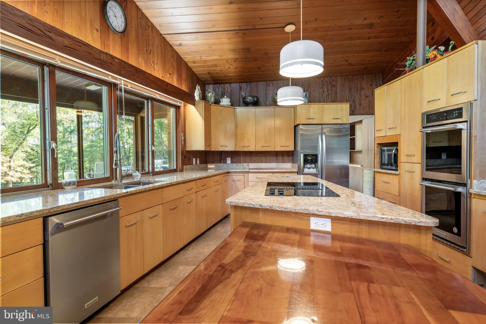 108 South Spring Valley Road Wilmington, DE 19807 - Photo 38 of 84 a large kitchen with a large window cabinets and stainless steel appliances
