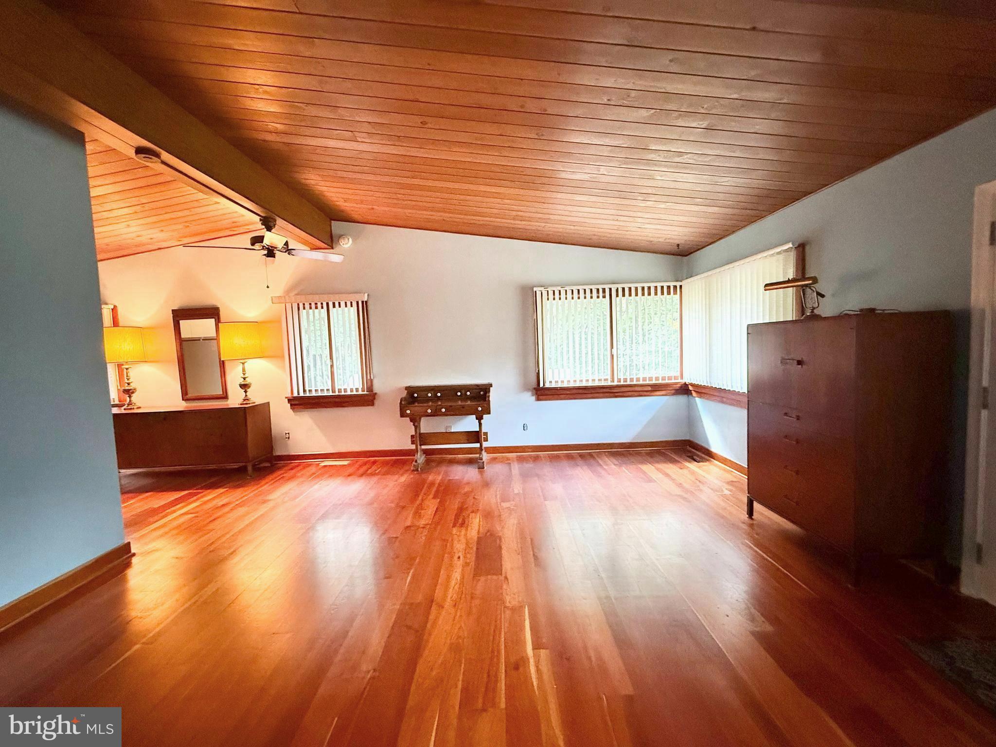 108 South Spring Valley Road Wilmington, DE 19807 - Photo 44 of 84 a view of an empty room with wooden floor and a window