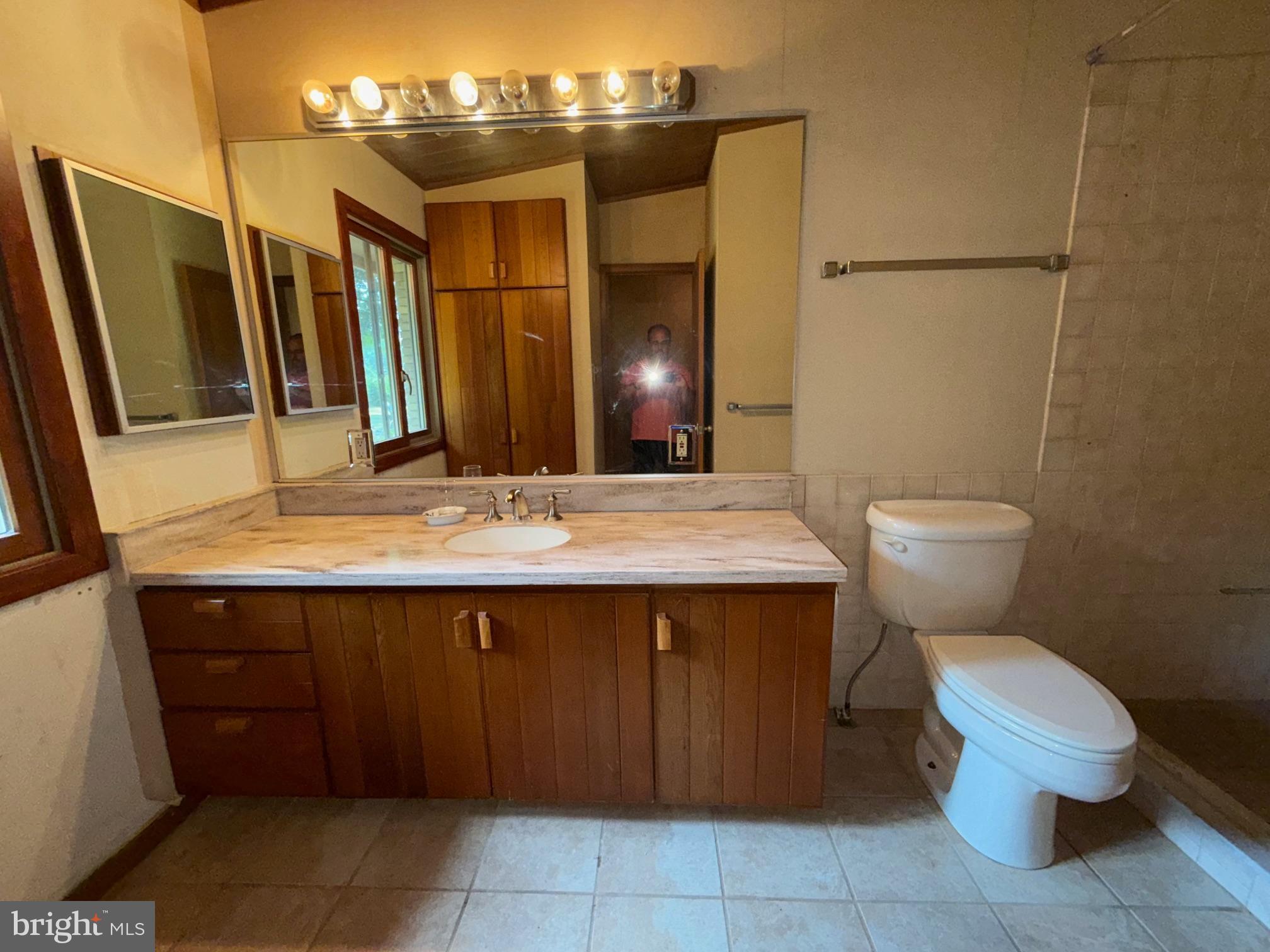 108 South Spring Valley Road Wilmington, DE 19807 - Photo 54 of 84 a bathroom with a sink and a mirror