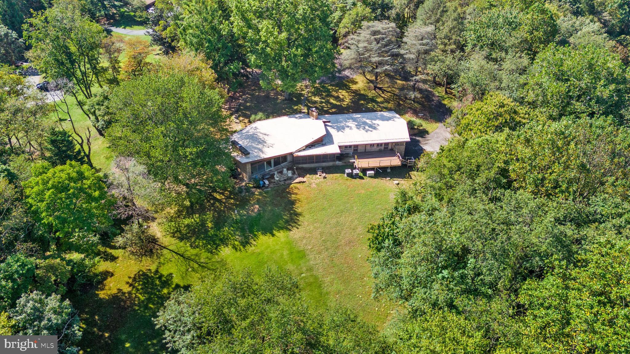 108 South Spring Valley Road Wilmington, DE 19807 - Photo 79 of 84 an aerial view of a house with a yard and lake view