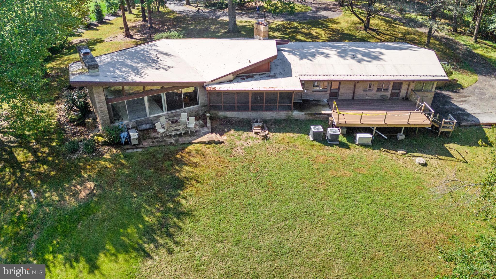 108 South Spring Valley Road Wilmington, DE 19807 - Photo 80 of 84 an aerial view of a house with swimming pool and large trees