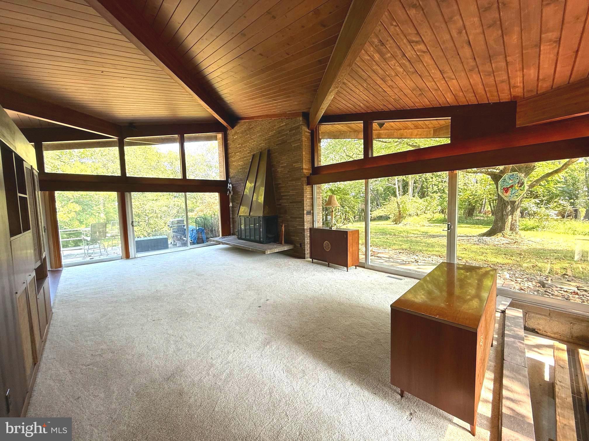 108 South Spring Valley Road Wilmington, DE 19807 - Photo 8 of 84 a living room with furniture and floor to ceiling windows