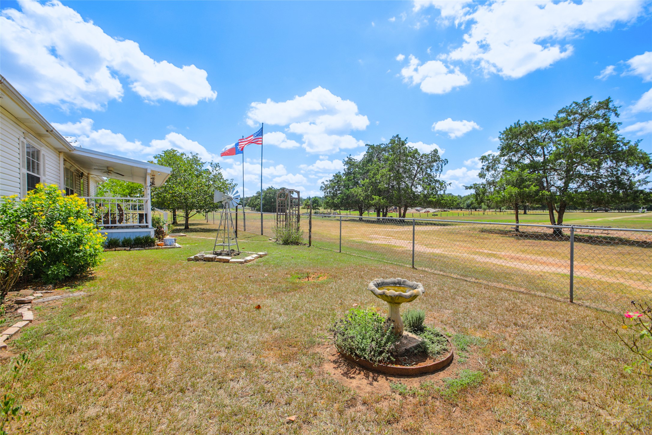 372 Hofferek Road Rosanky, TX 78953 - Photo 5 of 40 View of yard featuring a ceiling fan and a porch