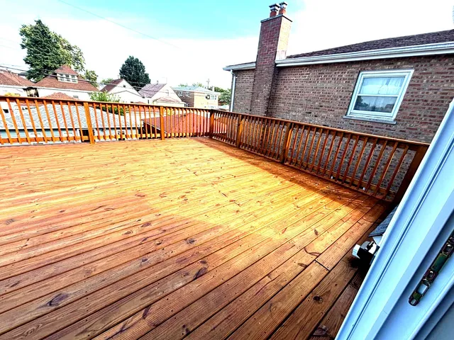 a view of balcony with wooden floor