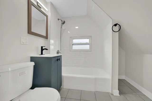 a bathroom with a toilet sink and bathtub