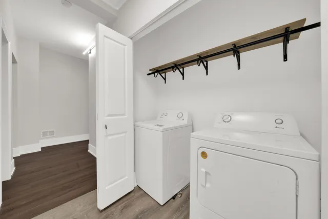 a view of storage and utility room with washer and dryer