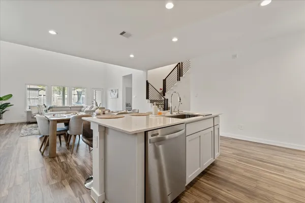 a kitchen with a sink and stove