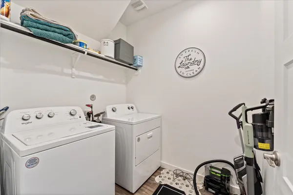a view of storage and utility room with a washer and dryer